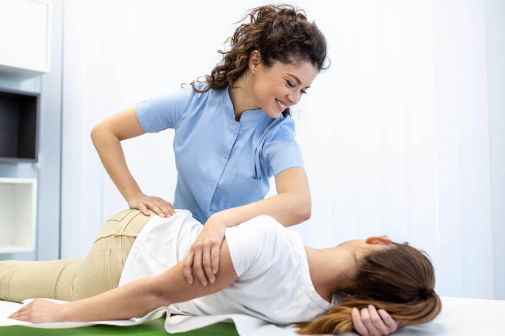 Chiropractor adjusting a patient, representing RWS roots in chiropractic business development